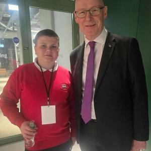 A pupil from Dalintober Primary School meets First Minister John Swinney