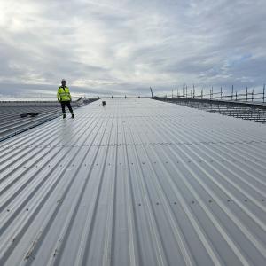 Image shows contractors working on the roof of the leisure centre 