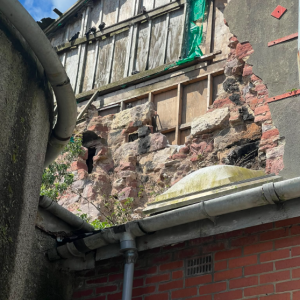 Photograph showing partial collapse of gable to 5/7 East Clyde Street